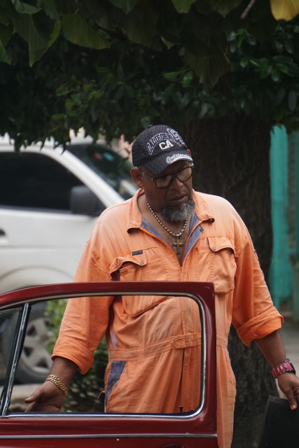 Man getting out of his car in Havana.